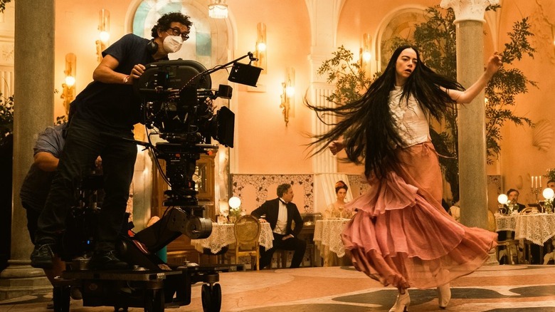 Behind the scenes photo of Emma Stone dancing in Poor Things